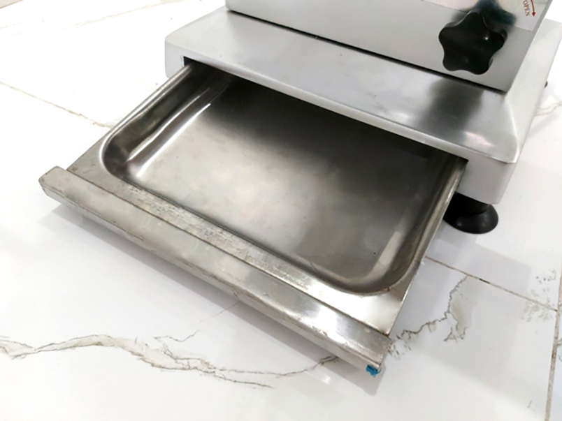 Khay đựng vụn xương sau khi cắt của máy cưa xương J210